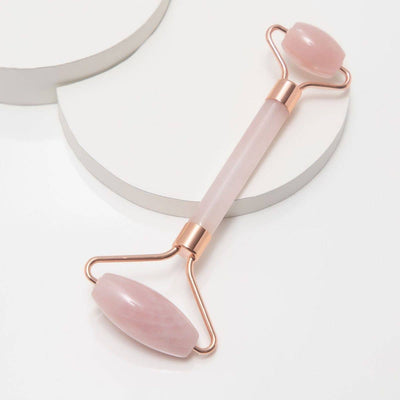 pink handle with pink quartz crystal roller for face massage 